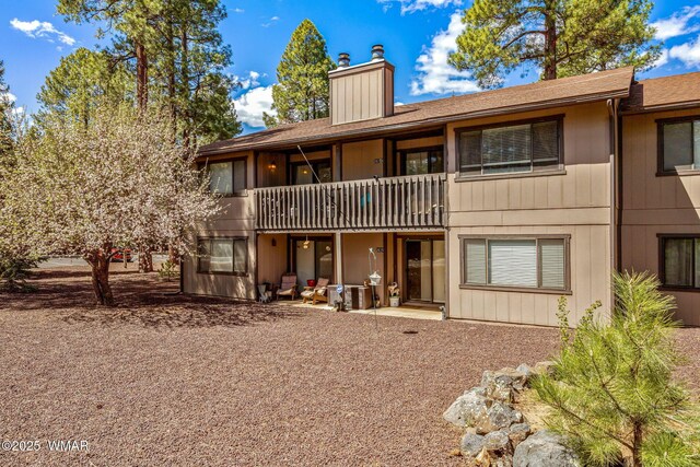2670 Snow Slope Way, Pinetop, AZ 85935 - back of house with a chimney and a shingled roof