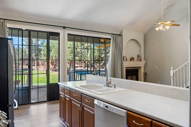 6853 Rim Rock Rd, Show Low, AZ 85901 - kitchen with white dishwasher, plenty of natural light, freestanding refrigerator, light wood finished floors, and lofted ceiling