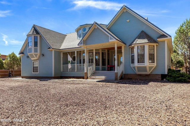 6853 Rim Rock Rd, Show Low, AZ 85901 - back of house featuring covered porch and roof with shingles