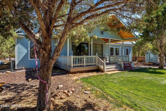 6853 Rim Rock Rd, Show Low, AZ 85901 - view of front of home with a storage unit, a front lawn, and covered porch