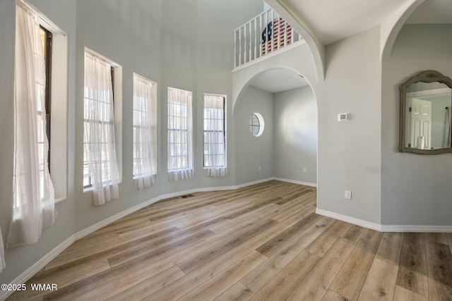 6853 Rim Rock Rd, Show Low, AZ 85901 - unfurnished room featuring wood finished floors and arched walkways