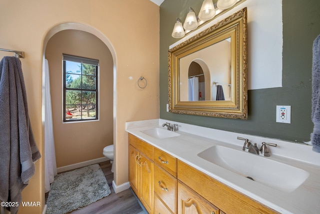 6853 Rim Rock Rd, Show Low, AZ 85901 - bathroom with double vanity and wood finished floors