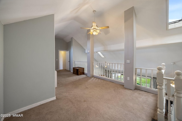 6853 Rim Rock Rd, Show Low, AZ 85901 - unfurnished living room featuring a ceiling fan, carpet flooring, plenty of natural light, and lofted ceiling