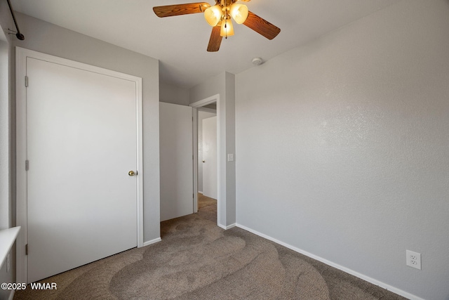 864 S 1st St E, Snowflake, AZ 85937 - unfurnished bedroom featuring carpet flooring, baseboards, and ceiling fan