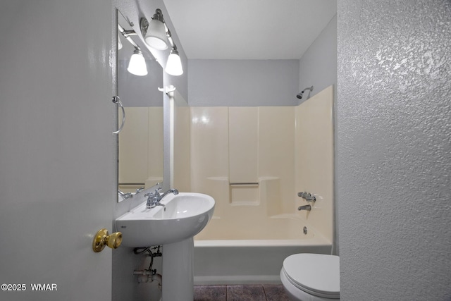 864 S 1st St E, Snowflake, AZ 85937 - bathroom with toilet, bathtub / shower combination, tile patterned flooring, and a textured wall