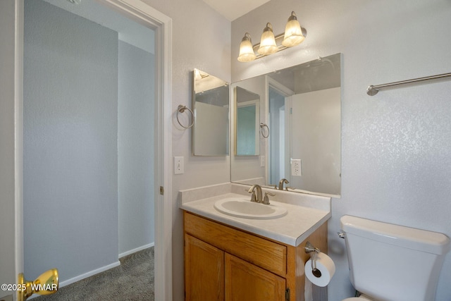 864 S 1st St E, Snowflake, AZ 85937 - half bathroom featuring vanity, toilet, and baseboards