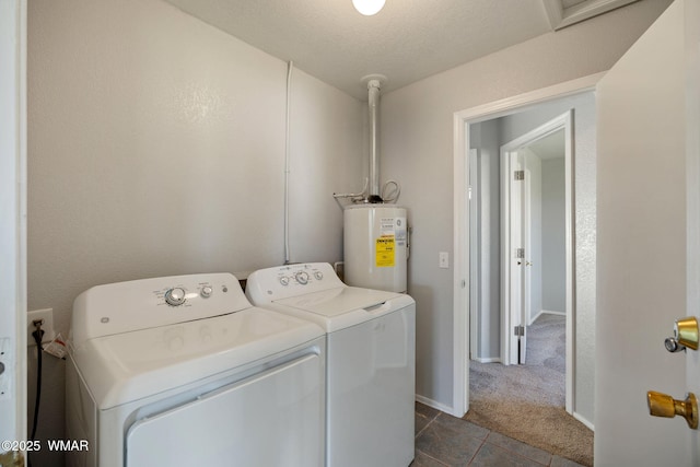 864 S 1st St E, Snowflake, AZ 85937 - washroom featuring water heater, washing machine and clothes dryer, dark tile patterned flooring, dark colored carpet, and baseboards