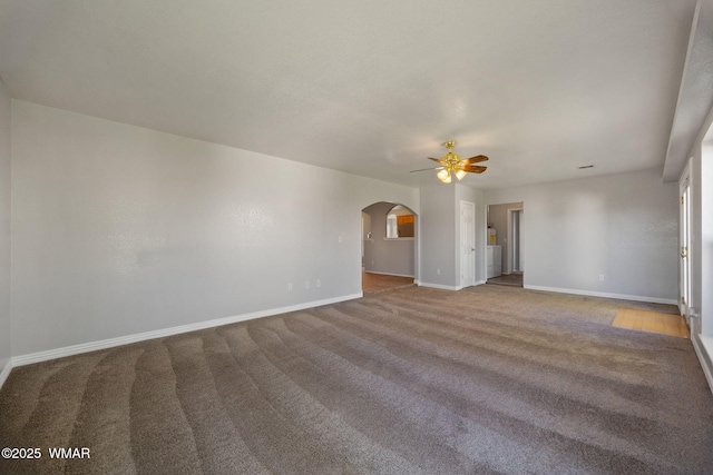 864 S 1st St E, Snowflake, AZ 85937 - unfurnished room featuring arched walkways, a ceiling fan, carpet flooring, and baseboards