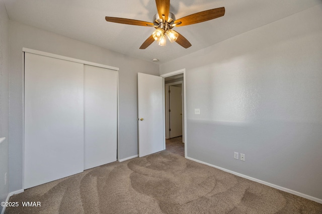 864 S 1st St E, Snowflake, AZ 85937 - unfurnished bedroom with carpet floors, a closet, baseboards, and a ceiling fan
