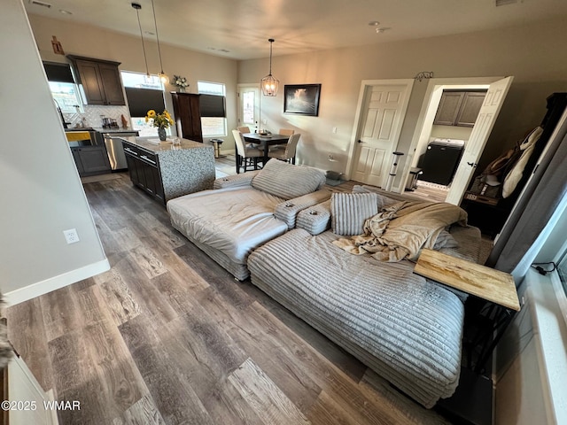 bedroom with baseboards and wood finished floors