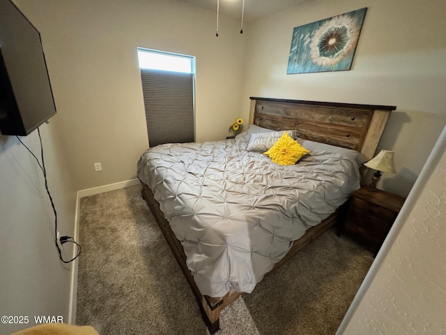 carpeted bedroom with baseboards