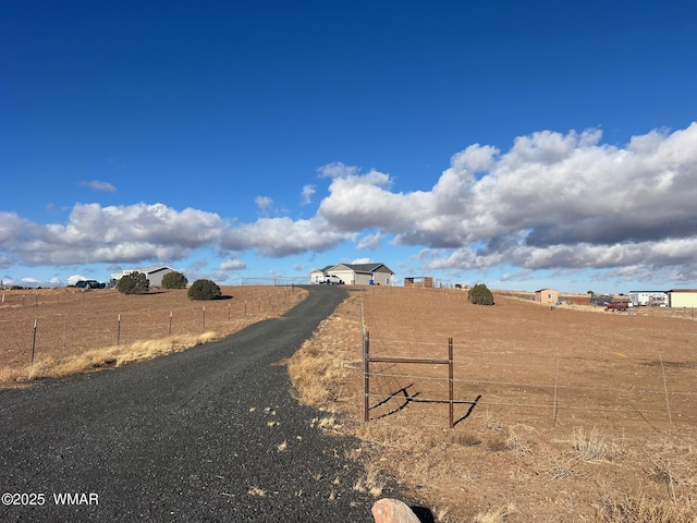 exterior space with a rural view and fence