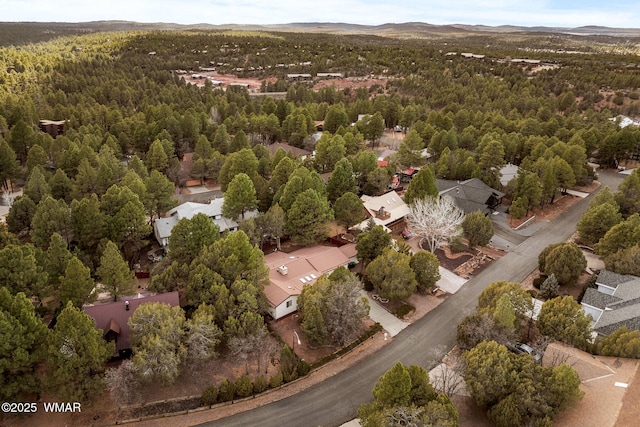 bird's eye view with a wooded view and a mountain view