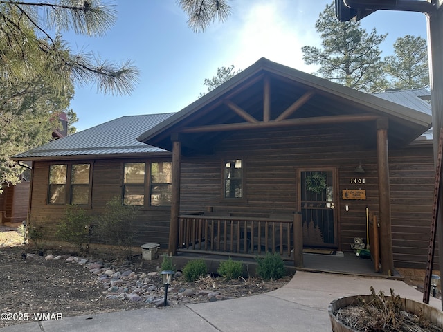 1401 S Spruce Ln, Show Low, AZ 85901 - view of front facade with covered porch and metal roof