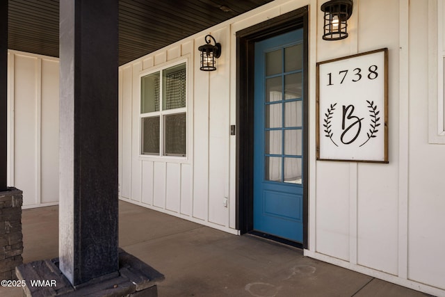 1738 W 7th St, Snowflake, AZ 85937 - view of exterior entry with board and batten siding and covered porch