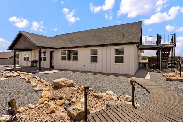 1738 W 7th St, Snowflake, AZ 85937 - rear view of house featuring board and batten siding, roof with shingles, a patio, stairs, and a wooden deck