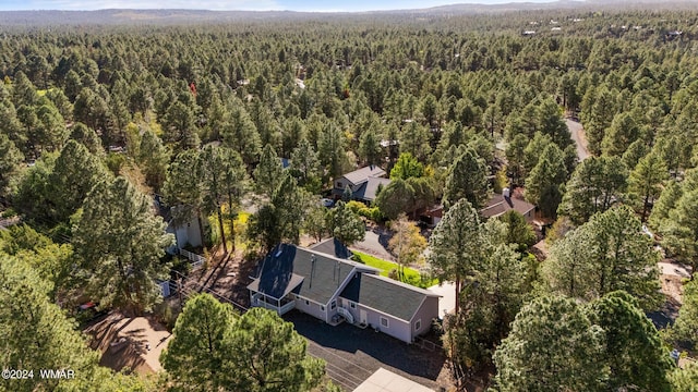 aerial view featuring a view of trees