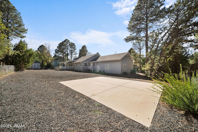 exterior space featuring a patio area and fence