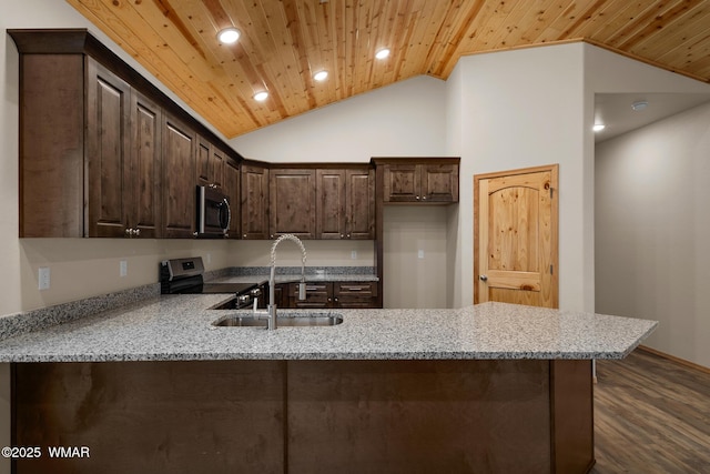 kitchen with wooden ceiling, a peninsula, a sink, vaulted ceiling, and appliances with stainless steel finishes