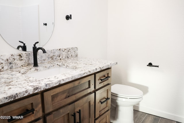 1316 W 7th St S, Snowflake, AZ 85937 - bathroom featuring vanity, baseboards, wood finished floors, and toilet