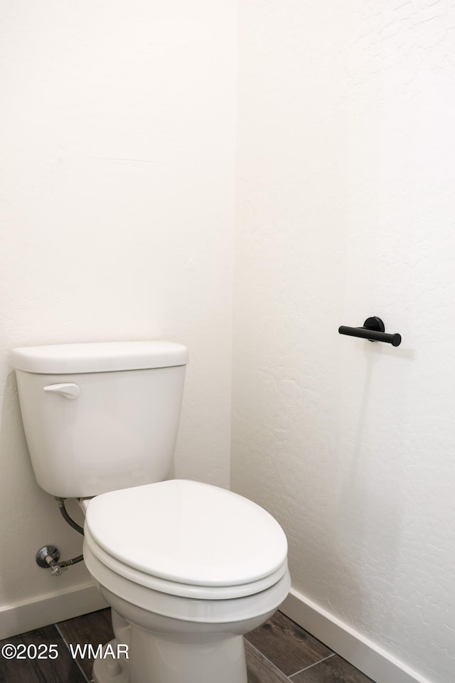 1316 W 7th St S, Snowflake, AZ 85937 - bathroom with baseboards, wood finished floors, and toilet