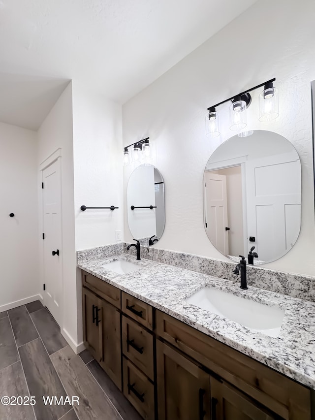 1316 W 7th St S, Snowflake, AZ 85937 - full bathroom with double vanity, baseboards, and wood finished floors