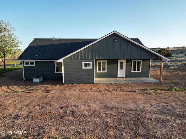 1316 W 7th St S, Snowflake, AZ 85937 - rear view of house with a patio, a shingled roof, and board and batten siding