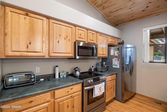 2740 W Maple Ln, Show Low, AZ 85901 - kitchen featuring a toaster, lofted ceiling, dark countertops, light wood-type flooring, and appliances with stainless steel finishes