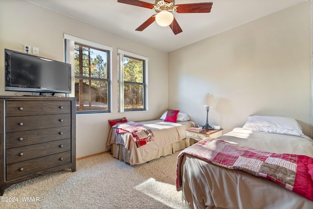 2740 W Maple Ln, Show Low, AZ 85901 - bedroom featuring baseboards, ceiling fan, and light colored carpet
