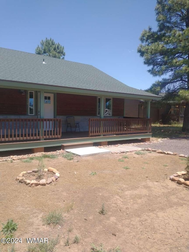 view of front of home featuring a shingled roof