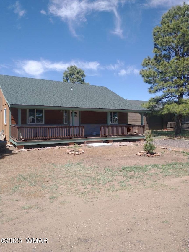 view of front of house with a shingled roof