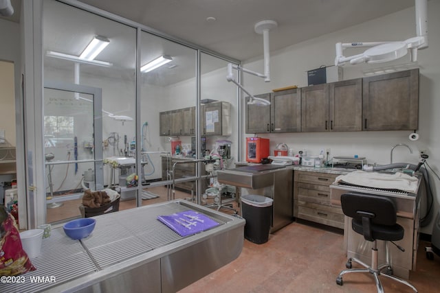 kitchen with concrete flooring and light countertops