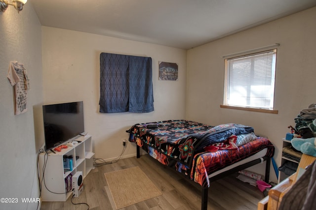 bedroom featuring light wood-style flooring