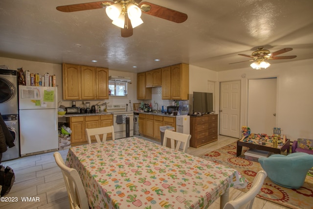 dining area featuring stacked washing maching and dryer