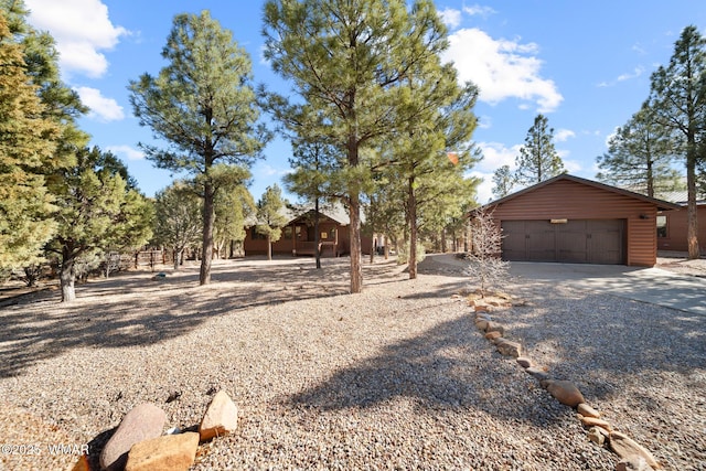 view of front facade with a garage and an outdoor structure