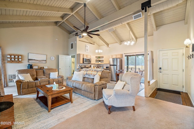 living room featuring visible vents, wooden ceiling, beamed ceiling, high vaulted ceiling, and ceiling fan with notable chandelier