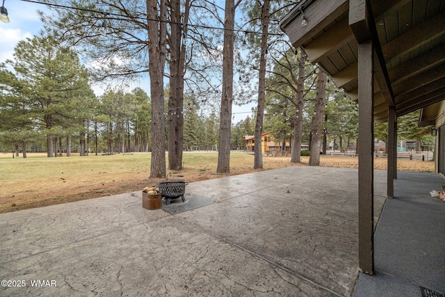 view of patio / terrace with an outdoor fire pit