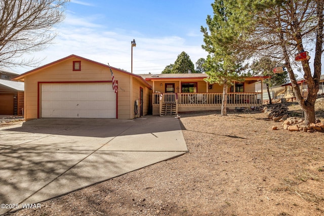 ranch-style home with covered porch, a garage, and concrete driveway