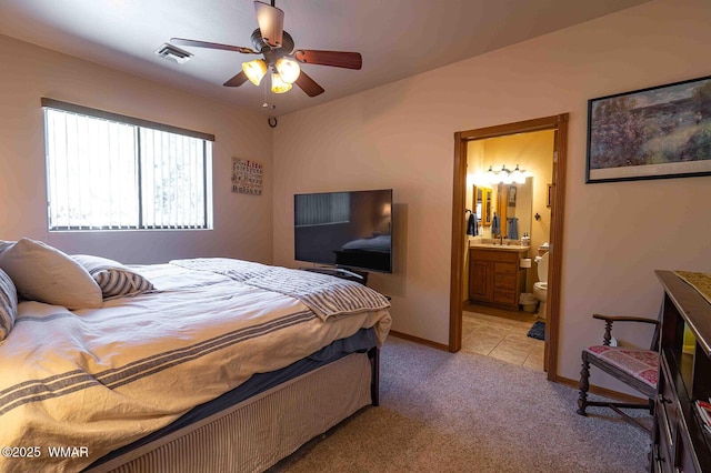 6757 Cheney Ranch Loop, Show Low, AZ 85901 - bedroom with light carpet, connected bathroom, and ceiling fan