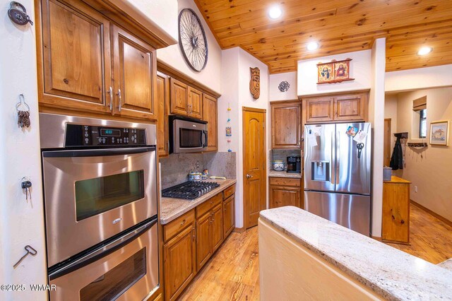 6757 Cheney Ranch Loop, Show Low, AZ 85901 - kitchen featuring stainless steel appliances, wooden ceiling, light wood-style flooring, brown cabinets, and tasteful backsplash