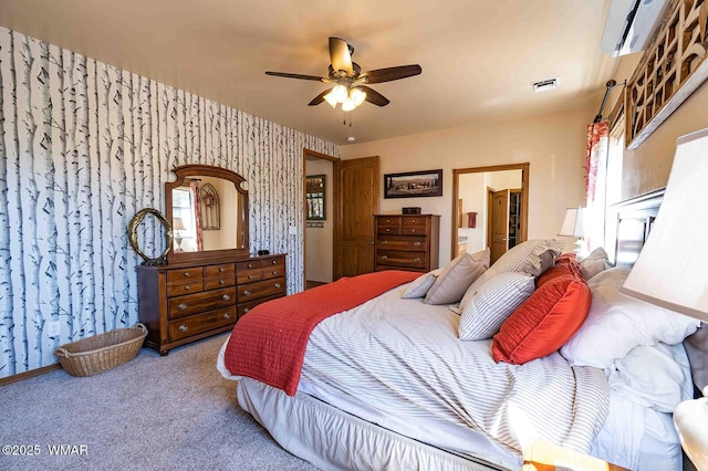 6757 Cheney Ranch Loop, Show Low, AZ 85901 - carpeted bedroom featuring a wall unit AC, wallpapered walls, a ceiling fan, and ensuite bath