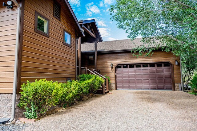 6757 Cheney Ranch Loop, Show Low, AZ 85901 - view of property exterior featuring asphalt driveway and an attached garage