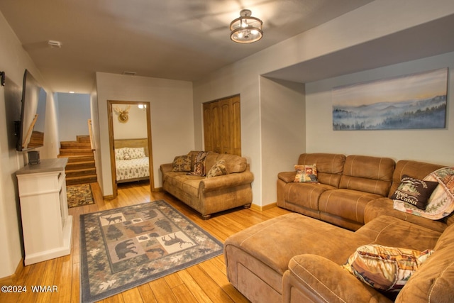 2020 S Pleasantview Dr, Show Low, AZ 85901 - living area with stairway, light wood-style flooring, and baseboards