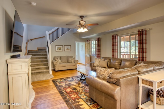 2020 S Pleasantview Dr, Show Low, AZ 85901 - living area featuring light wood finished floors, stairway, a ceiling fan, and baseboards