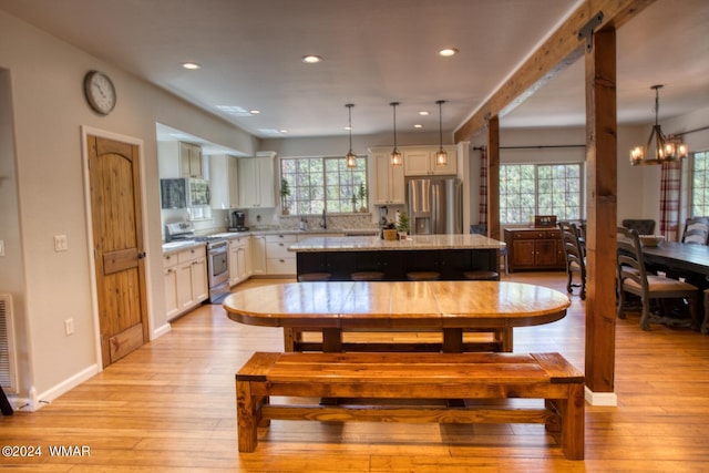 2020 S Pleasantview Dr, Show Low, AZ 85901 - dining area with light wood-type flooring, a chandelier, and recessed lighting