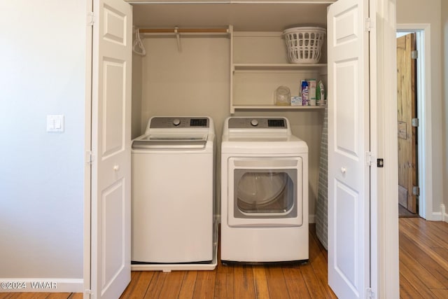 2020 S Pleasantview Dr, Show Low, AZ 85901 - laundry room featuring washer and clothes dryer and wood finished floors