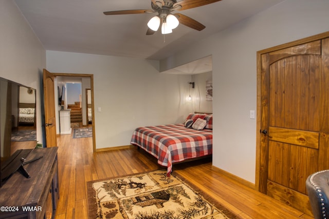 2020 S Pleasantview Dr, Show Low, AZ 85901 - bedroom with hardwood / wood-style floors, baseboards, and a ceiling fan