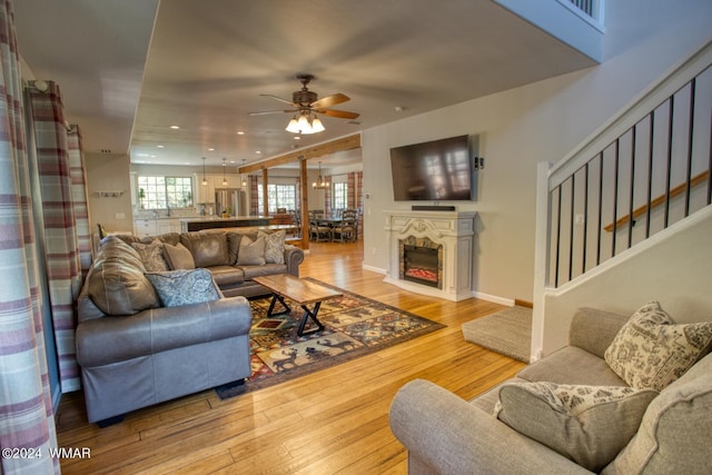 2020 S Pleasantview Dr, Show Low, AZ 85901 - living room featuring a ceiling fan, hardwood / wood-style flooring, stairway, recessed lighting, and baseboards