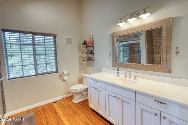 2020 S Pleasantview Dr, Show Low, AZ 85901 - bathroom featuring toilet, vanity, wood finished floors, and baseboards