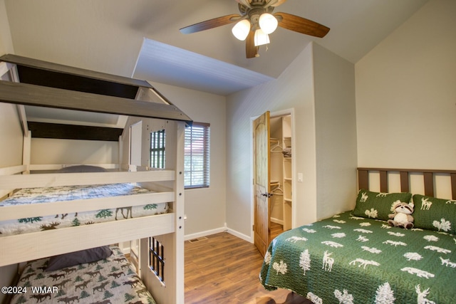 2020 S Pleasantview Dr, Show Low, AZ 85901 - bedroom with wood finished floors, a walk in closet, lofted ceiling, ceiling fan, and baseboards